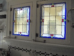 Original stained glass windows in the bathroom